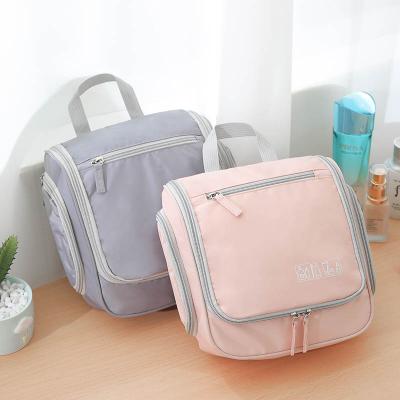 China Waterproof And Wear-resistant Multi Option Hook Color Large Capacity Ladies Buckle Drawstring Bag Travel Makeup Storage Cosmetic Bag for sale