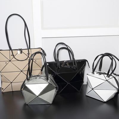 China New Fashoion Laser Geometric Rhombic Portable Soft Folding Mini Handbag Deformation Bag for sale