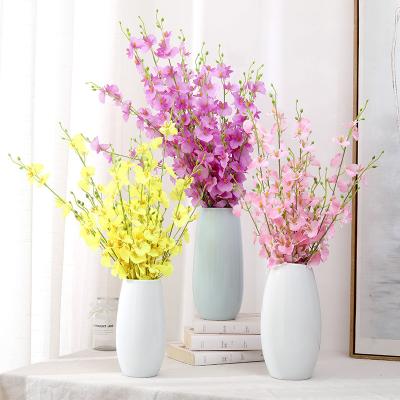 China Wenxin artificial flowers high simulation dancing orchid flowers five-fork yellow plastic dry phalaenopsis yellow silk orchid flowers large or for sale