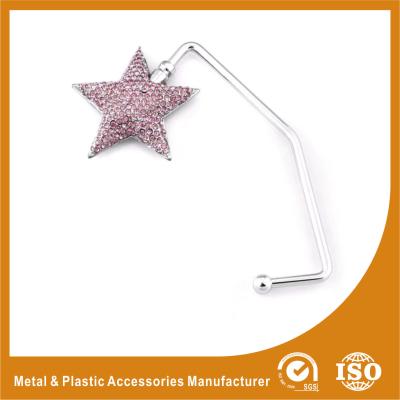 China Zinc Alloy Star Shape Purse Hook Hanger For Table Top Purse Hanger for sale