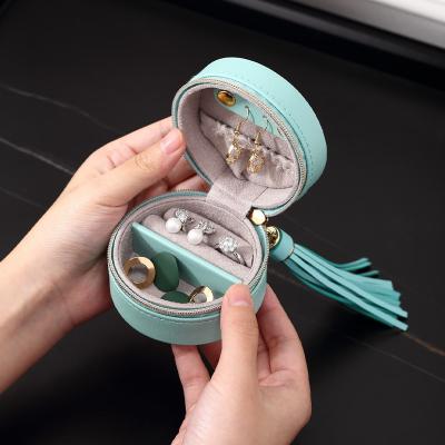 China Portable Tiny Round Jewelry Travel Box Wholesale Travel Roll Jewelry Organizer Earring Necklace Jewelery Packaging Storage Box for sale