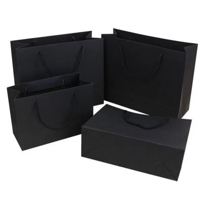 China Recycled Materials Logos Art Paper Gift Package Printed Paper Bags Boutique Custom Shopping Bag With Black Ribbon Handle for sale