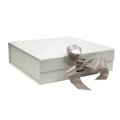 China Handmade Wholesale Rigid Empty Luxury Custom Craft Cardboard Magnetic Folding Paper Gift Box With Ribbon for sale