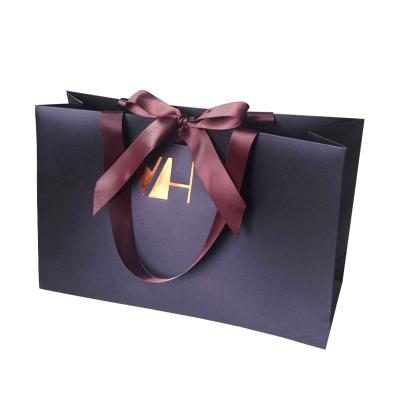 China Best Selling Handmade High Quality Custom Geometric Design Paper Gift Bags With Flat Paper Handles for sale