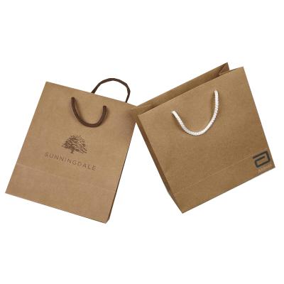 China Handmade Recyclable Kraft Paper Bag Shopping Bag Gift Bag With Handles for sale