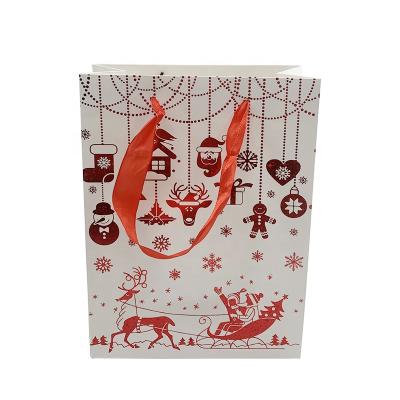 China Merry Cartoon Recyclable Different Patterns Christmas Gift Packaging Logo Printing White Card Customization Paper Bag For Transportation for sale