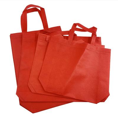 China Recyclable Grocery Wholesale Handled Non Woven Bag Wholesale Custom Personalized Promotional Reusable Fabric For Shopping Tote Bags RED for sale