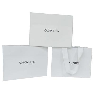 China Custom Recyclable Logo Printed Matt Finish White Paper Shopping Bag With Grosgrain Ribbon Handle for sale