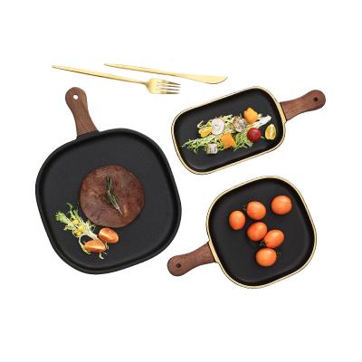 China 2021 Viable Wholesale OEM Customized Black Gold Edge Kitchen Plates Matte Wood Handle Ceramic Dinner Dishes for sale