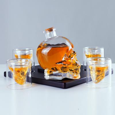 China Modern Skull Whiskey Decanter Set Wine Bottle Glasses With Wooden Base for sale