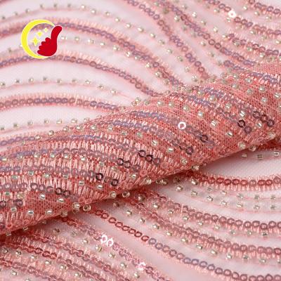 China Good quality luxury glitter viable embroidery beads bridal pink 3d sequined beaded lace fabric for sale