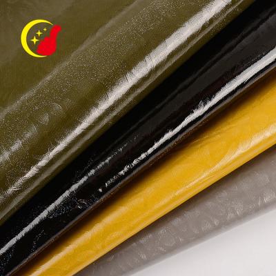 China Cheap Dyed Abrasion-Resistant Knitted PU Glossy Genuine Synthetic Exotic Leather Fabric For Upholstery for sale