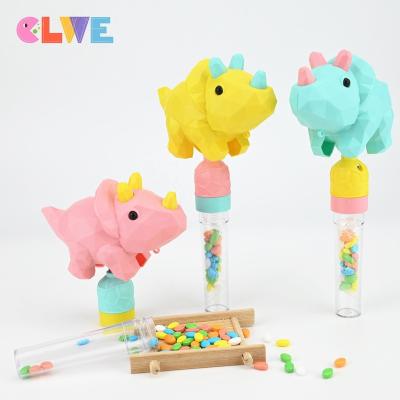 China Cartoon Toys Good Quality ABS Novelty Macarone Color Shake Giggle Triceratops Toy Candy Kidsmania Shaking Hiss Dinosaur Candy Toy for sale