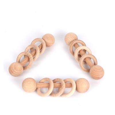 China Toddler Beech Wood Musical Teether Ring Montessori Toys Wooden Rattle Grasping Toys for sale