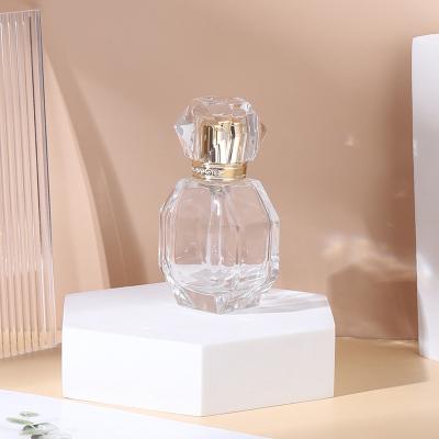 China Custom LOGO 30ml Gold Cosmetic Premium Glass Perfume Bottle With Diamond-encrusted Cosmetic Spray Bottle for sale