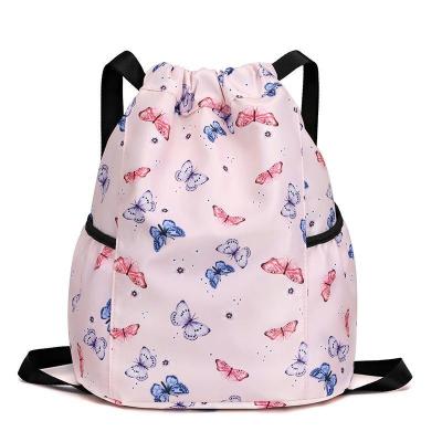 China Waterproof Easy and portable backpacks cartoon printed primary school children's backpacks waterproof bundle pocket for sale