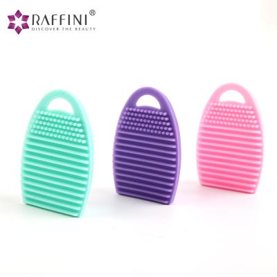 China Beauty Care Cosmetics Factory Best Selling Egg Shaped Ring Portable Silicone Makeup Brush Cleaner Mat for sale