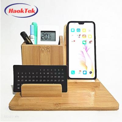 China Mobile Phone 3 in 1 Storage Box Desktop Cell Phone Wooden Radio Charging Bamboo Charging Station with Pen Holder for sale