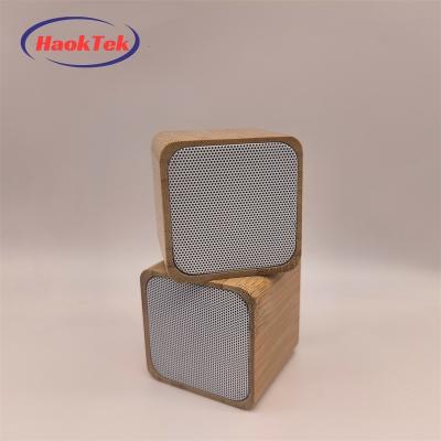 China Wholesale LED Flashing Light HAOKTEK Eco Friendly Portable Mini Wooden Outdoor Bluetooth Portable Radio Led Small Light Speaker for sale