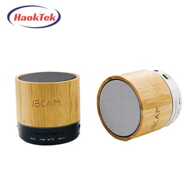 China HAOKTEK Round Toothless Wooden Bamboo Blue Wireless Speaker Small Portable Speaker For Home for sale