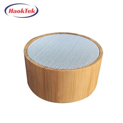 China Discount Price Small Native Factory HAOKTEK Mini Round Wireless Bluetooths Wooden Speaker for sale