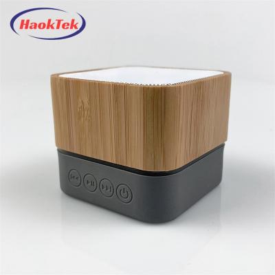 China LED Flashing Light New HAOKTEK Bamboo Mini Portable Wireless Speaker Led Light bluetooth for sale