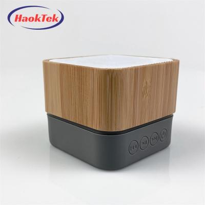 China Viable Mini Bamboo Wood Speaker Rechargeable BT Bluetooths Square Portable Wireless Blue Tooth LED Flashing Light HAOKTEK Led Light Speaker for sale