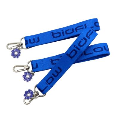 China Promotion Polyester Hand Wrist Key Chain Strap Blue Short Chain Lanyard With Flower Accessory for sale