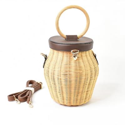 China 2022 Small Cool Rattan Sandbag Motion Sensing Handbag Bucket Bag Women's Bag for sale