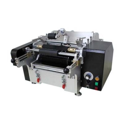 China Food Manual Wet Glue Round Jars Labeling Machine With Paper Label for sale