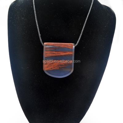 China Handmade Wooden Jewelry Epoxy Resin Necklace Wood And Resin Wooden Pendants for sale