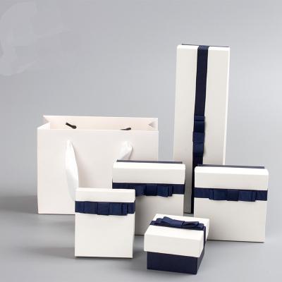 China Eco-friendly Jewelry Ring Earring  Box White Paper Jewelry Organizer Boxes With Blue Bow Ring Earrings Necklace Jewelry Cardboard Packaging Box for sale