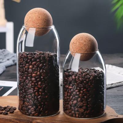 China Eco - Friendly Cylinder Clear Glass Jar With Round Ball Cork Lid Coffee Bean Glass Jar for sale