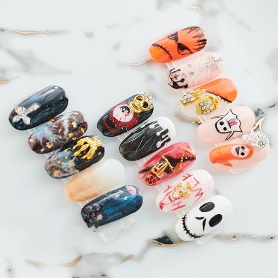 China Clear Rhinestone Halloween Skeleton Hands Rhinestone Nails Art Decor Manicure Alloy Red Skull Nail Metal Charm 3D Nail Art Decorations for sale