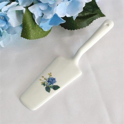 China LEXI Wholesale Porcelain Safe Ceramic Cake Spatula Cutter Pizza Spatula Sustainable Cake Spatula With Flower Pattern For Cake Desserts for sale