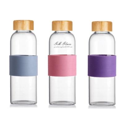 China Custom Eco Friendly 500ml Clear Glass Water Bottle Viable With Silicone Sleeve Borosilicate Bamboo Lid Drinking Leak Proof for sale