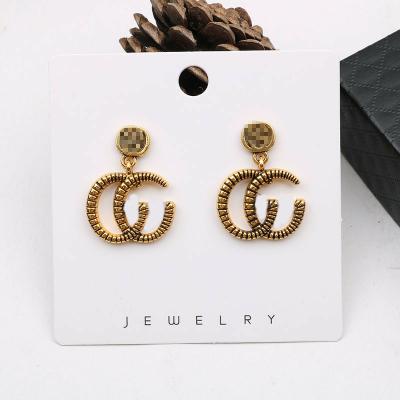 China Popular brands of fashion earrings trend CLASSIC gold plated alloy circle earring designer earrings for cute girls for sale