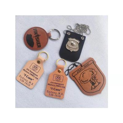 China Clothing Crafts Car Gifts Custom Military Logo Leather Tag Leather With Metal Badge Metal Car Key Chain Wholesale for sale