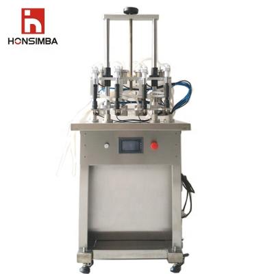 China Hot Sale Food HONSIMBA DQX500L Maneuverable Environmental Four Head Scent Vacuum Filling Machine for sale