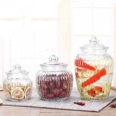 China Food Glassware Home Decoration Pumpkin Shape 550ml 1000ml 1500ml Food Storage Candy Glass Jars With Lids for sale