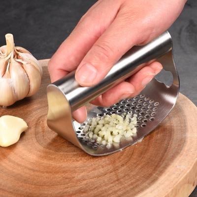 China Viable 2 in 1 All 304 Stainless Steel Garlic Press Rocker Rocker Crusher Meat Grinder Garlic Cutter with Bottle Opener for sale