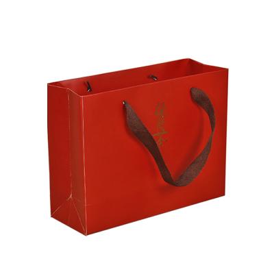 China Recyclable Custom Printing Red Paper Bags With Ribbon Handle for sale