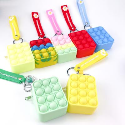 China Hot Selling Daily Mini Silicon Coin Purse Push Bubbles Key Chained Person Bag Busy Person Sensory Purse Toys for sale