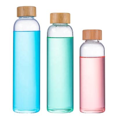 China Amazon Hot Selling Reusable Borosilicate Glass Beverage Juice Drink Mineral Water Bottle With Bamboo Lid for sale