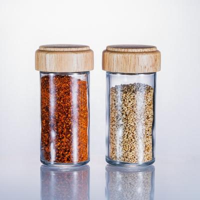 China Wholesale 100ml Sustainable Wooden Lid Kitchen Spice Bottle Glass Seasoning Shaker for sale