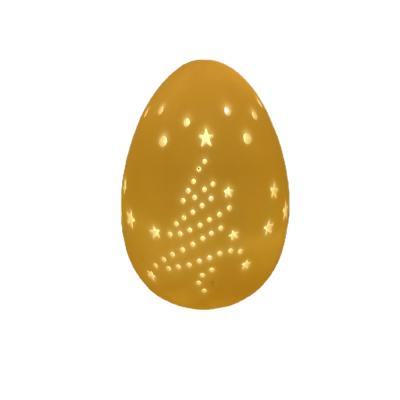 China Ceramic Egg Decoration LED Ceramic Egg Shape For Easter Holiday With Christmas Tree Cutout Design for sale