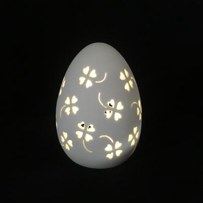 China Ceramic Egg Decoration Four Leaf Clover Cutout Ceramic Eggs LED Night Light For Decoration for sale