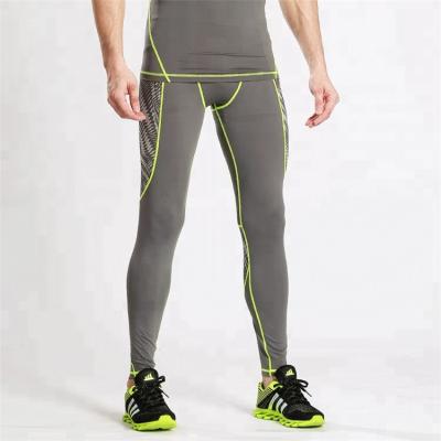 China Cheap Anti-Static Joggers Sports Tracksuit Men Compression Sports Pants Tights Sportswear Plastic Custom Pants for sale