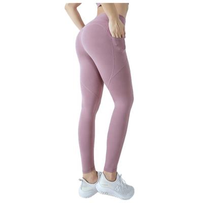 China Antibacterial High Quality Girls Workout Gaiters Moisture Wicking Spandex Fabric Nylon Yoga Pants With Pocket For Women for sale