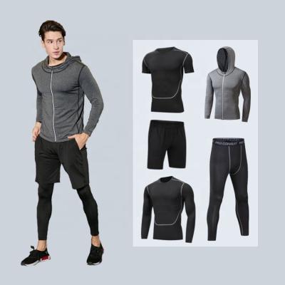 China Breathable Wholesale Sportswear Men Quick Dry Compression Wear Fits Adults Polyester Spandex 5 Piece Gym Fitness Sets for sale